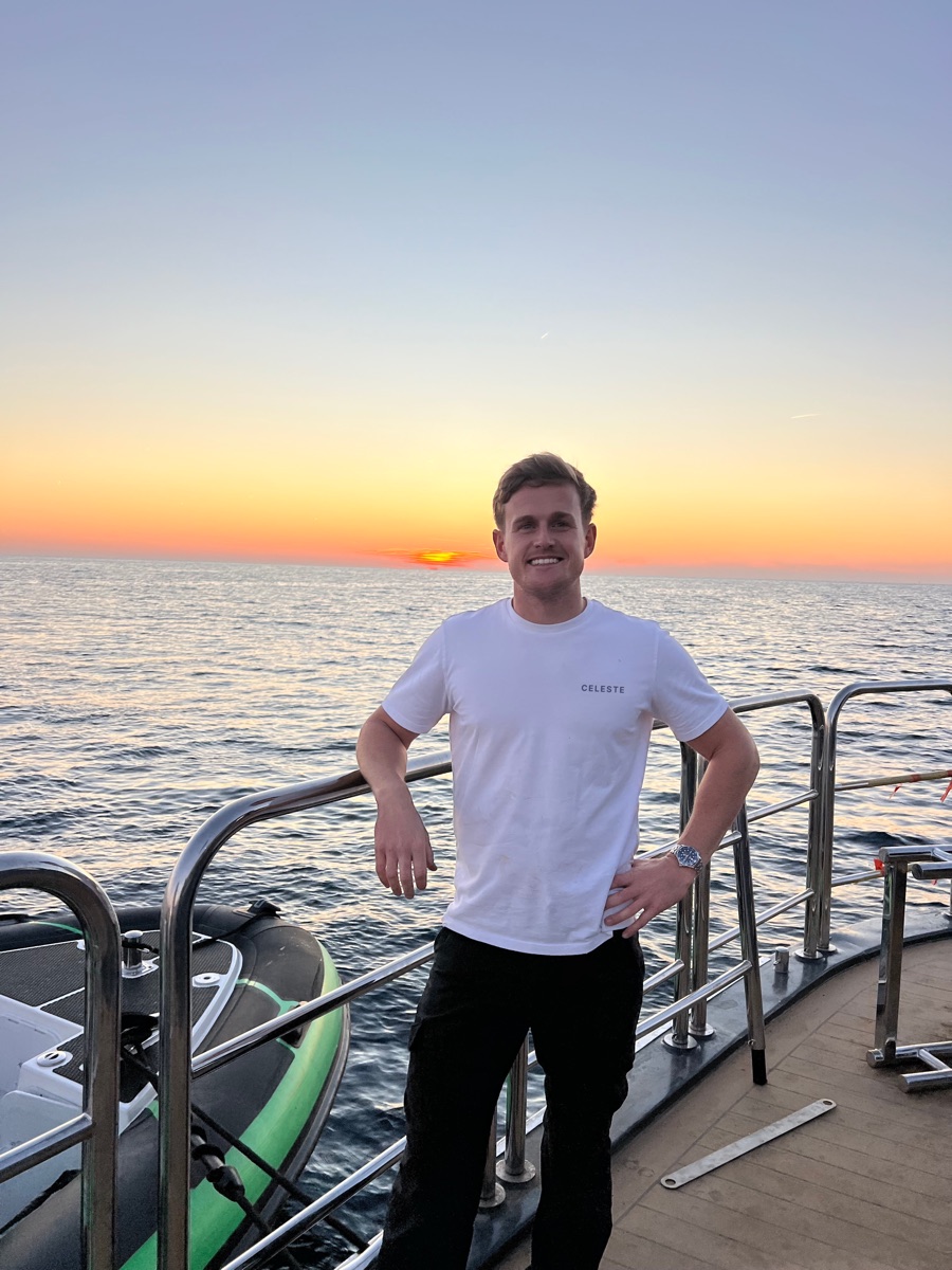 Alex Short, founder of CelesteOS, aboard a vessel at dusk